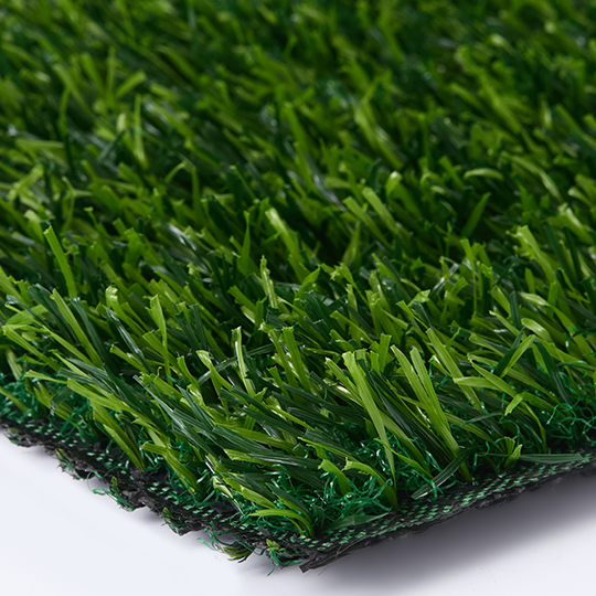 Angled close-up of an artificial grass sample corner and backing