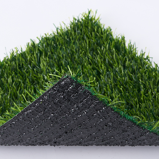 Artificial grass sample corner folded back to show its backing