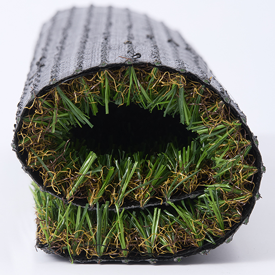 A rolled and folded piece of artificial turf, with the pile visible inside the roll