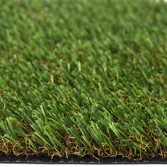 Low side view of turf blades and the dark backing edge